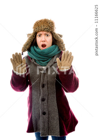 Young woman in warm clothing and making stop gesture sign Young woman in warm clothing and making stop gesture sign 11166625