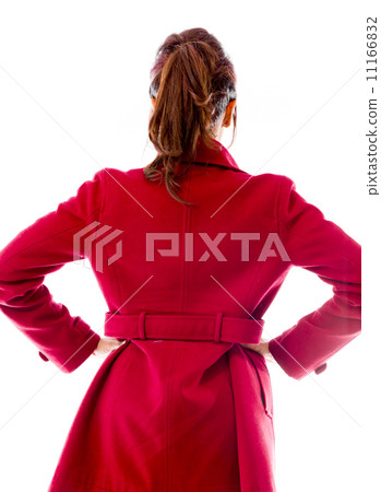 Rear view of an Indian young woman standing with her arms akimbo 11166832