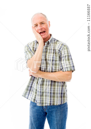 Senior man smiling with hand on cheek 11166887