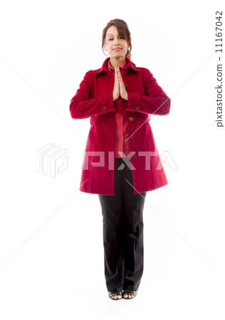 Indian young woman standing in prayer position Indian young woman standing in prayer position 11167042