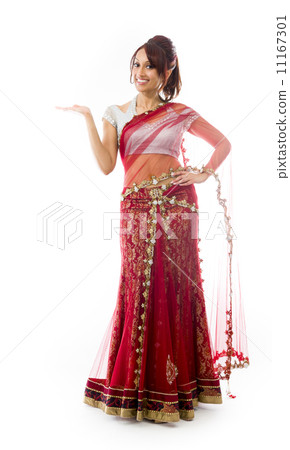 Young Indian woman showing product with open hand palm 11167301