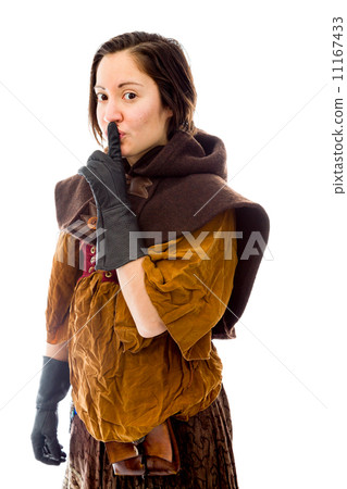 Young woman standing with finger on lips 11167433