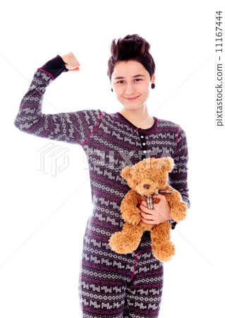 Young woman standing and flexing biceps 11167444