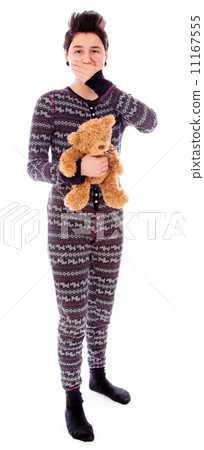 Young woman holding teddy bear with hand over her mouth 11167555