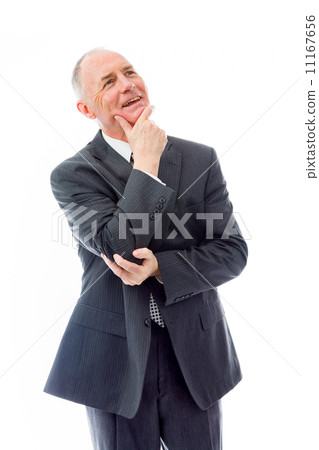 Businessman day dreaming with hand on chin Businessman day dreaming with hand on chin 11167656