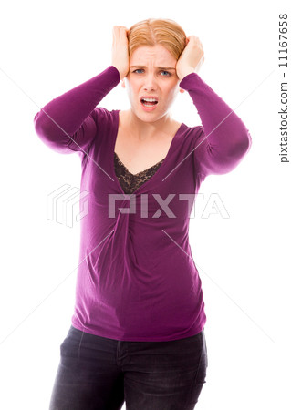 Young woman looking frustrated and pulling her hair Young woman looking frustrated and pulling her hair 11167658