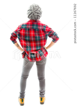 Rear view of a young woman standing with her arms akimbo 11167692
