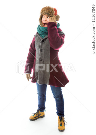 Young woman in warm clothing and looking shocked 11167849