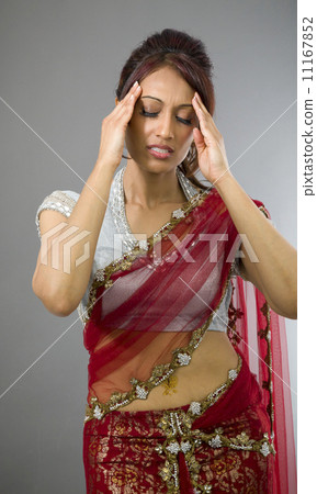 Young Indian woman suffering from headache Young Indian woman suffering from headache 11167852