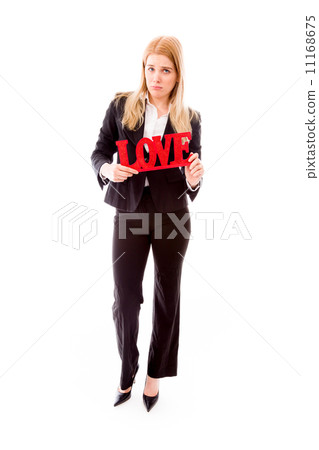 Disappointed businesswoman holding red "LOVE" text 11168675