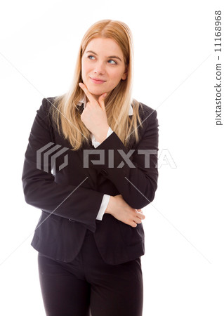 Businesswoman daydreaming with hand on chin 11168968