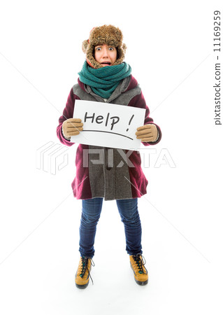 Young woman in warm clothing and showing help sign on white back Young woman in warm clothing and showing help sign on white back 11169259