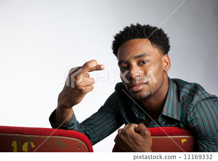 Attractive afro-american man posing in studio 11169332