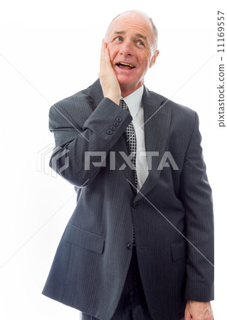 Businessman day dreaming with hand on cheek Businessman day dreaming with hand on cheek 11169557