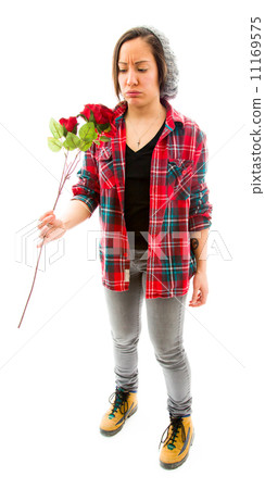 Young woman looking worried with holding rose Young woman looking worried with holding rose 11169575