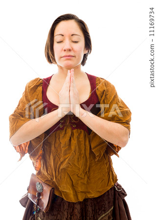 Young woman standing in prayer position 11169734