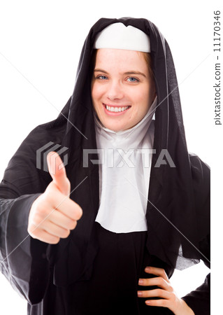 Young nun showing thumbs up sign and smiling 11170346