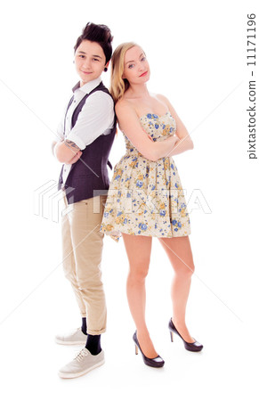 Lesbian couple standing with back to back with their arms crosse Lesbian couple standing with back to back with their arms crosse 11171196