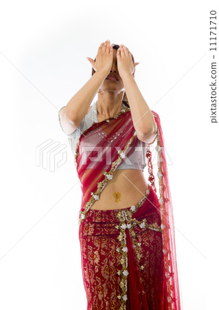 Young Indian woman covering her face with her hands 11171710