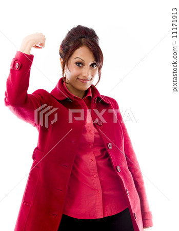 Indian young woman showing off her muscle Indian young woman showing off her muscle 11171913