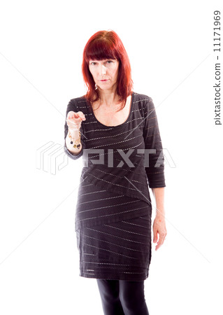 Mature woman pointing towards camera Mature woman pointing towards camera 11171969