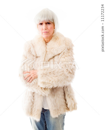 Senior woman standing with her arms crossed Senior woman standing with her arms crossed 11172234