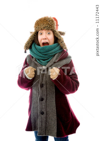 Young woman in warm clothing and shouting Young woman in warm clothing and shouting 11172443