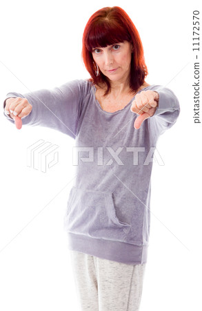 Mature woman showing thumbs down sign from both hands Mature woman showing thumbs down sign from both hands 11172570