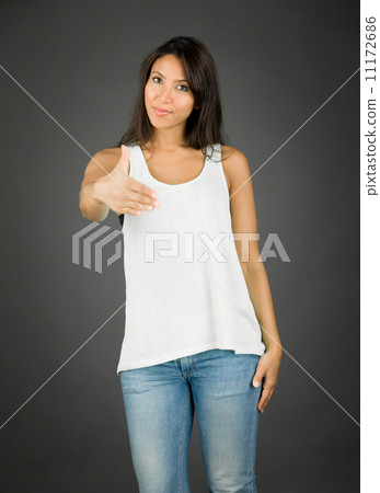 Young woman standing and offering hand for handshake Young woman standing and offering hand for handshake 11172686