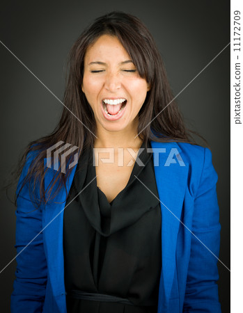 Happy young businesswoman shouting in excitement 11172709