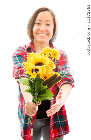 Young woman offering bouquet of sunflowers and smiling Young woman offering bouquet of sunflowers and smiling 11172863