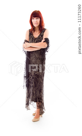 Mature woman standing with her arms crossed Mature woman standing with her arms crossed 11173260