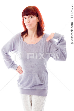 Mature woman standing with her hand on hip Mature woman standing with her hand on hip 11173279