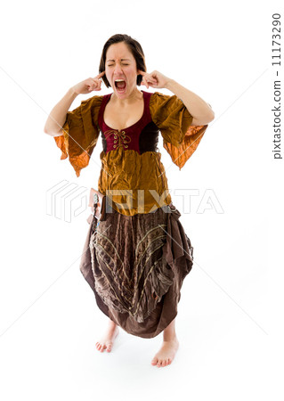 Young woman shouting with fingers in her ears 11173290