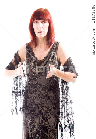 Mature woman standing and gesturing 11173386