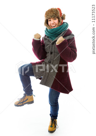 Young woman in warm clothing and gesturing Young woman in warm clothing and gesturing 11173523