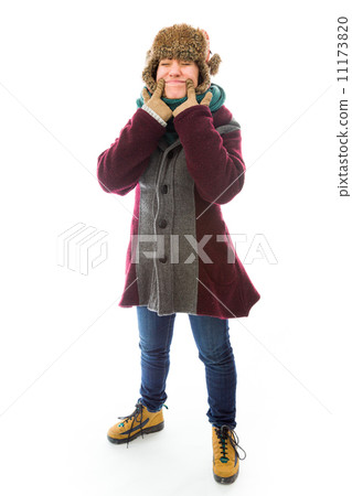 Young woman in warm clothing and showing smiley face 11173820