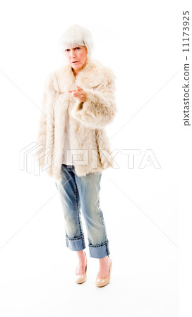 Senior woman pointing towards camera Senior woman pointing towards camera 11173925