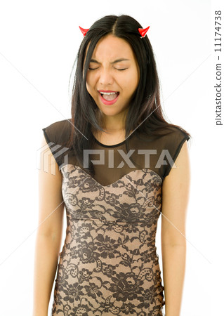 Asian young woman dressed up as a devil and shouting in excitement isolated on white background Asian young woman dressed up as a devil and shouting in excitement isolated on white background 11174738