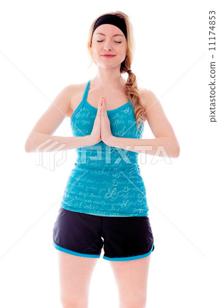 Young woman standing in prayer position 11174853