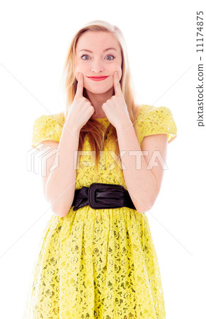 Beautiful young woman standing and showing smiley face Beautiful young woman standing and showing smiley face 11174875