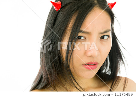 Devil side of a young naked Asian woman looking sad 11175499