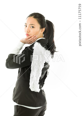 Asian young businesswoman dressed up as white angel with her hand on chin and looking bored isolated on white background Asian young businesswoman dressed up as white angel with her hand on chin and looking bored isolated on white background 11175759