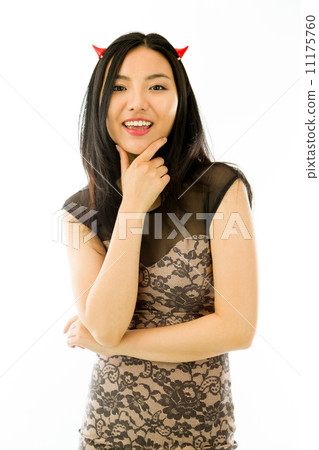 Asian young woman dressed up as a devil and smiling isolated on white background Asian young woman dressed up as a devil and smiling isolated on white background 11175760
