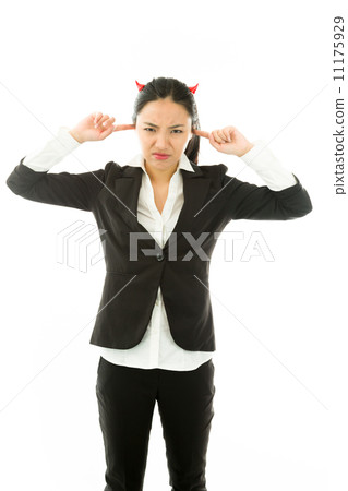 Devil side of a young Asian businesswoman standing with fingers in ears and looking frustrated isolated on white background Devil side of a young Asian businesswoman standing with fingers in ears and looking frustrated isolated on white background 11175929