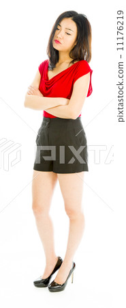 Young woman standing with her arms crossed and looking sad Young woman standing with her arms crossed and looking sad 11176219