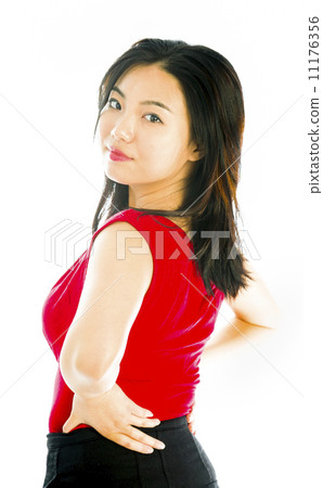 Young woman standing with her arms akimbo 11176356