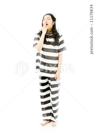 Young Asian woman yawning in prisoners uniform Young Asian woman yawning in prisoners uniform 11176634