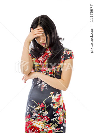 Asian young woman hiding her face Asian young woman hiding her face 11176677