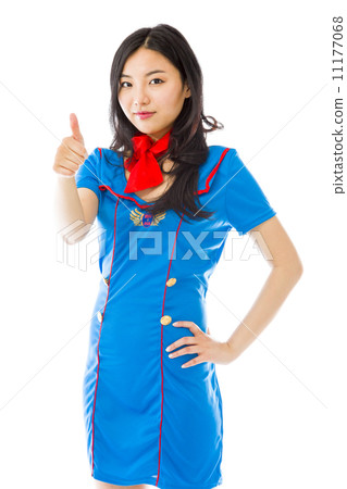 Asian air stewardess making thumbs up sign standing with hand on hip Asian air stewardess making thumbs up sign standing with hand on hip 11177068